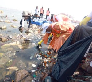 CM Yogi along with ministers conducts  cleanliness drive at Arail Ghat in Prayagraj